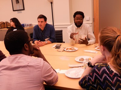First Book Institute participant Jarvis McInnis engages with PSU graduate students Lisa McGunigal and Brandon Erby over lunch.