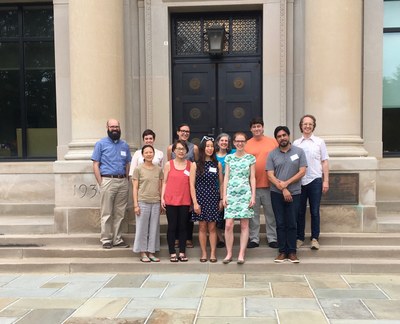 Jordan Carroll, Graduate RA Liana Glew, Katie Walkiewicz, Co-director Priscilla Wald, Co-director Sean Goudie, Ben Bascom, Juliana Chow, Sunny Xiang, Christine (Xine) Yao, Mary Kuhn, and Chris Perreira pose in front of the Burrowes Building on the final day.