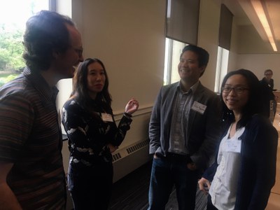 Participants Ben Bascom and Christine (Xine) Yao introduce themselves to PSU graduate students Rob Nguyen and Yi-Ting Chang at the luncheon.