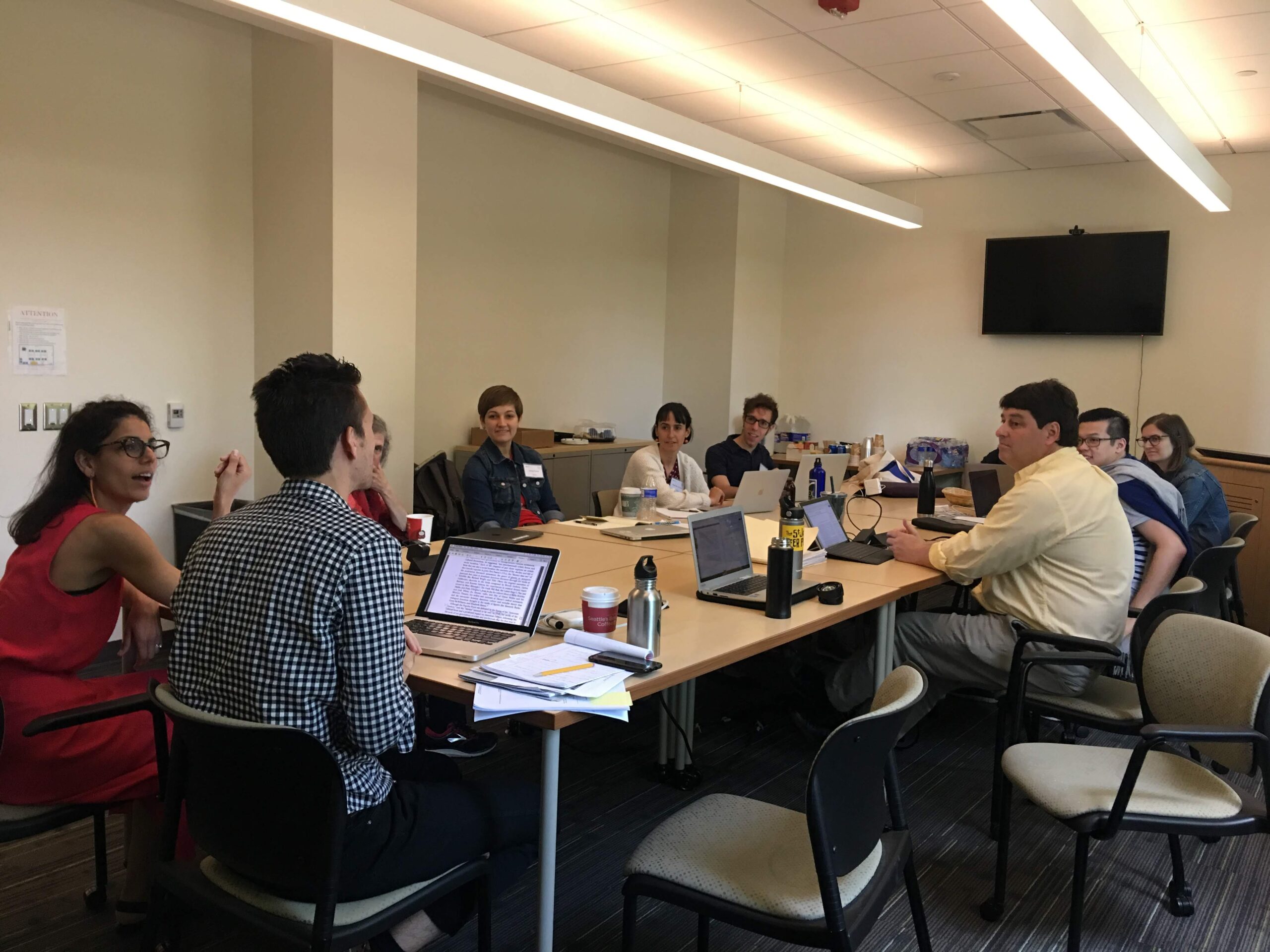 Cristina Pérez Jiménez and Alex Mazzaferro, at head of table, lead a discussion on how to write to and from multiple disciplines, while (L-R) Priscilla Wald, Christy Pottroff, Nissa Ren Cannon, Jesse Miller, Sean Goudie, Chris Eng, and Emily Hainze listen
