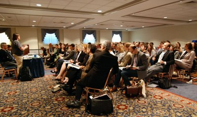 Right, Trish Loughran addresses a packed room on the morning of the first day of C19's inaugural conference, hosted by CALS at Penn State in 2010.
